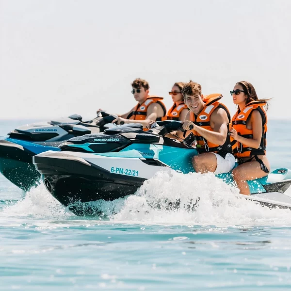 Group of friends riding jet skis side by side