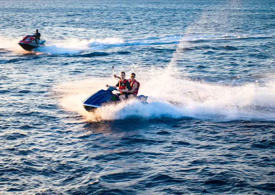Two friends riding a jet ski and leaving a white wake
