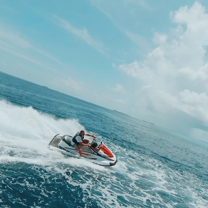 Jet ski carving a sharp turn with a big wake