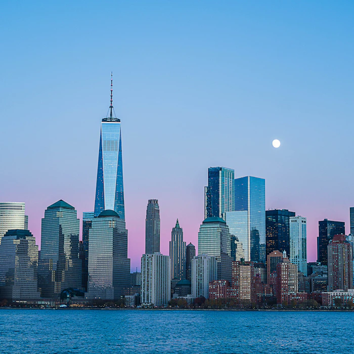 Lower Manhattan skyline at dusk seen from the water